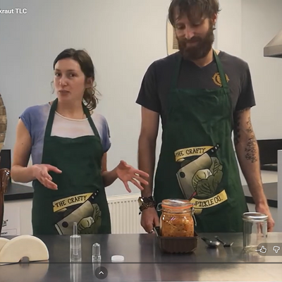Madi and Arthur in front of table with various fermenting aids