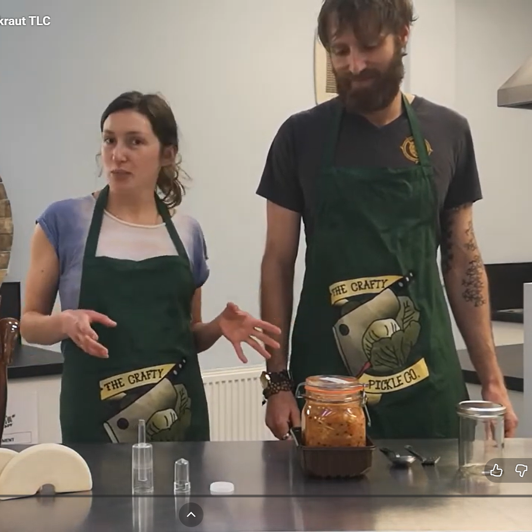 Madi and Arthur in front of table with various fermenting aids