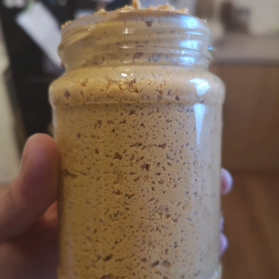 Glass jar containing fermented cashew cheese spread