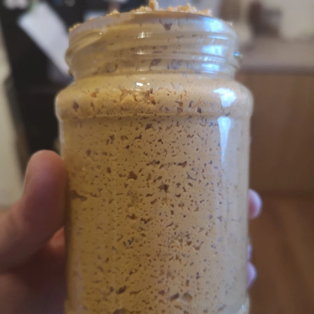Glass jar containing fermented cashew cheese spread