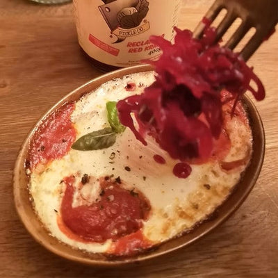 A dish of shakshuka and reclaimed red kraut